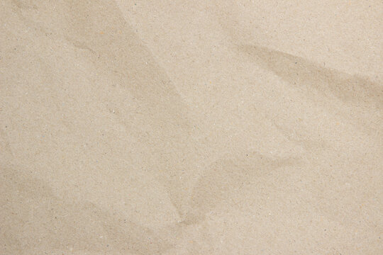 Old paper vintage texture surface for background. Recycle pale brown paper crumpled texture, Cream color recycled kraft paper texture blank with copy space for text.