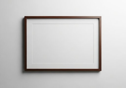 Empty horizontal wooden picture frame on a white textured wall