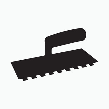 Black notched trowel silhouette on white background construction tool building tool