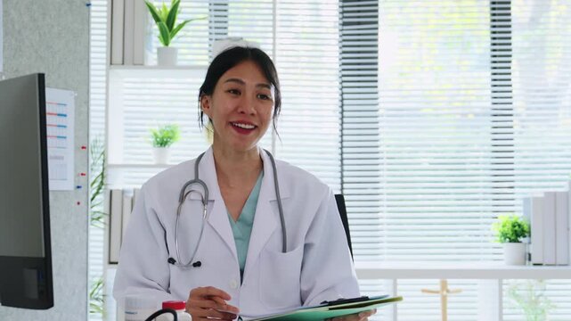 Doctor Explaining Medication to Senior Patient During Medical Consultation