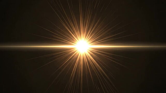 A bright golden light flare radiates from the center of a dark background
