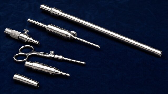 blowpipe. Polished blowpipe tools arranged on blue velvet with studio lighting. safety posters, maintenance manuals, designed for precision metalworking and fabrication facilities, used by engineers.