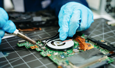 Fototapeta premium The technician repairing the motherboard in the lab with copy space. the concept of computer hardware, mobile phone, electronic