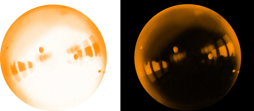 Orange glowing sphere with light reflections, abstract amber glass ball on white and black backgrounds, set of two circular crystal orbs