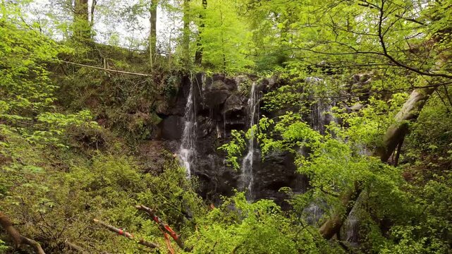Wide 4K 60FPS aerial reveal video of Glenariff Waterfall in County Antrim, Northern Ireland in the UK. Produced in 3840x2160 and with Rec709 color.