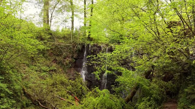 Reversing 4K 60FPS aerial video of Glenariff Waterfall in County Antrim, Northern Ireland in the UK. Produced in 3840x2160 and with Rec709 color.