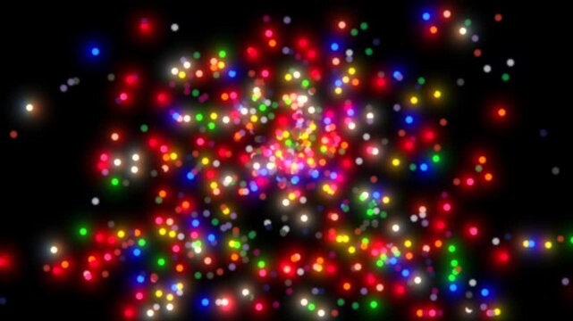 Tiny colorful light particles exploding and expanding animation