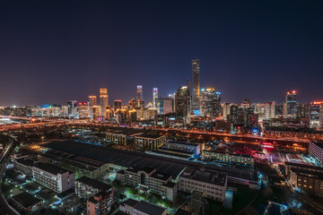 Fototapeta premium Panoramic night view of China Zun, Beijing CBD, showcasing the vibrant urban skyline of the bustling metropolis.