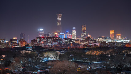 Looking out over the skyline of China Zun in Beijing's old city, the cityscape at night blends the ancient and modern. © 文普 王