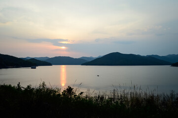 Fototapeta premium Mountain views and a summer sunset at Mae Kuang Udom Thara Dam, Chiang Mai Province, Northern Thailand.