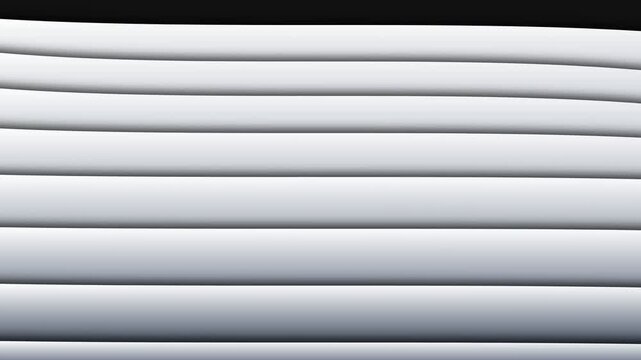 Abstract composition of parallel white cylindrical tubes in soft light