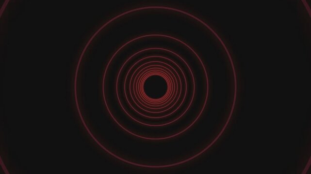Abstract red neon concentric circles forming a deep tunnel effect on black