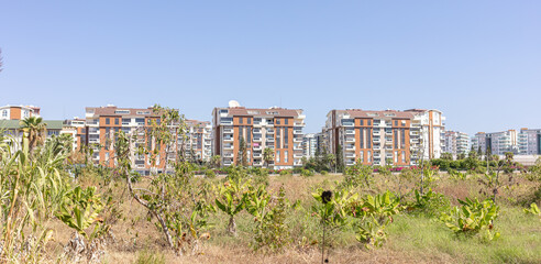 Obraz premium Modern residential buildings of Avsallar, Turkey, with green landscape in urban area