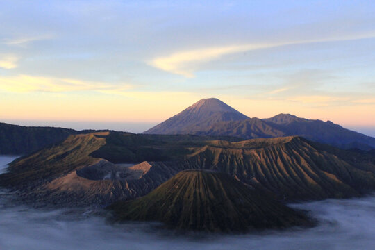 Mount Bromo Volcanic Crater at Sunrise with Sea of Clouds, Mount Semeru Background, East Java Indonesia