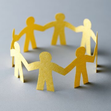 Paper people holding hands in unity circle, teamwork and global business connection symbolism