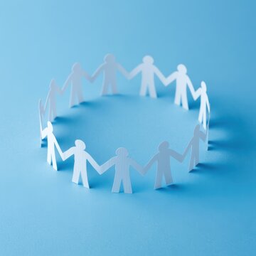 Paper people holding hands in unity circle, teamwork and global business connection symbolism