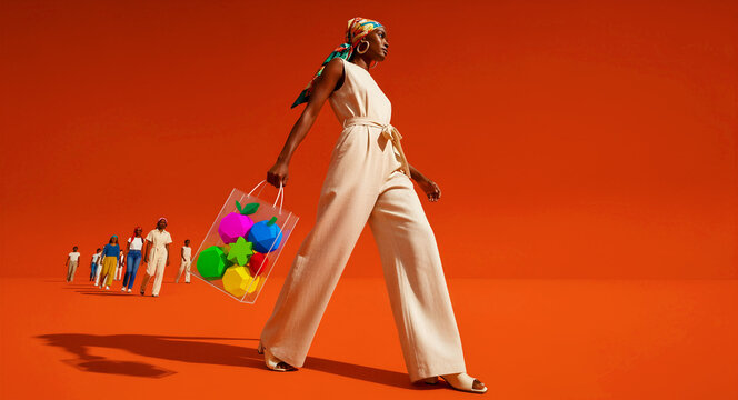 Black woman walking with a bag of geometric fruit on a bright orange background. Stylish group follows behind in this minimalist high-fashion scene. Creative concept for modern retail and style.