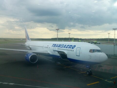 Wide-body passenger airplane Boeing 767-300ER of the Transaero airline parked on the tarmac at Domodedovo International Airport. Moscow, Russia, July 15, 2015. 