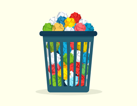 A blue wire mesh wastebasket overflowing with colorful crumpled paper balls.