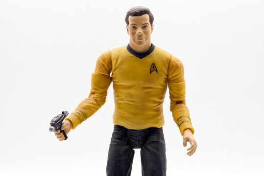 Bologna - Italy - April 8, 2026: Captain James T Kirk action figure toy holding a phaser isolated on white background.