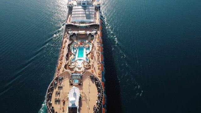 Elegant vessel with tranquil deck. Opulent maritime deck featuring serene blue waters and sun loungers