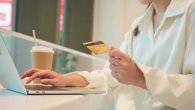 Gen Z business people shopping online woman hand typing keyboard password consumer holding credit card or debit and laptop