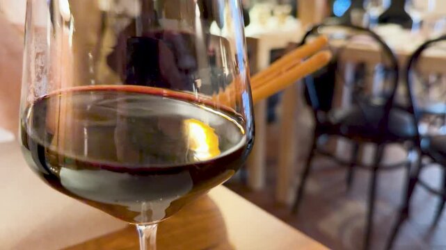 Close Up of Italian Red Wine Swirling in a Glass at a Restaurant