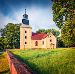 Impressive summer view of Stanislawa Kostki Catholic church. Marvelous morning cityscape of Karnice village, Gryfice County, West Pomerania, Poland, Europe. Traveling concept background. © Andrew Mayovskyy