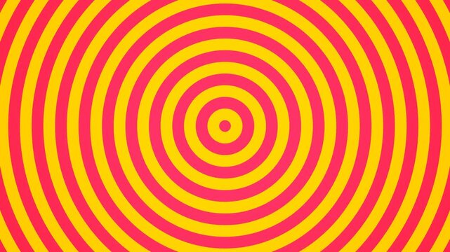 A vibrant circular pattern with repeating yellow and pink concentric rings
