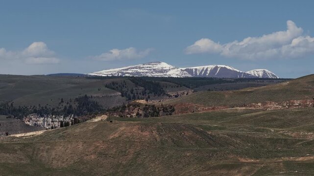 Aerial of snowy Uinta Mountains in Vernal Utah in Ashley National Forest in spring