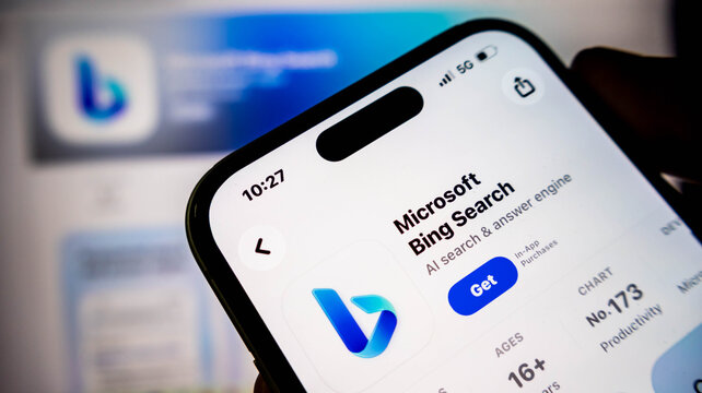Closeup of a smartphone screen displaying the microsoft bing search app page on the apple app store, showcasing the ai search and answer engine