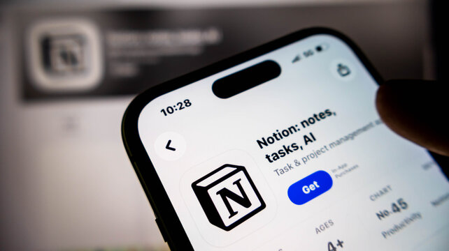 Closeup of a smartphone screen displaying the notion app store page, showcasing the logo and download button for productivity software