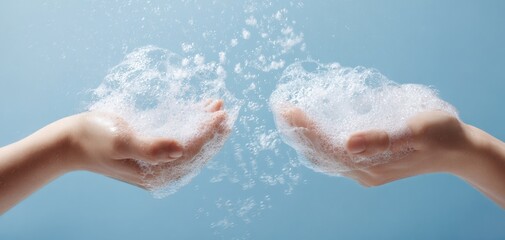 Fototapeta premium The Hands Holding Soapy Foam Splash Against a Soft Blue Background Studio Shot