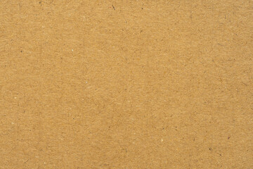 Fototapeta premium Top view of brown kraft paper texture background,Close-up texture of brown kraft paper sheet with fine fiber details, ideal for eco-friendly packaging design, organic branding, and rustic background.