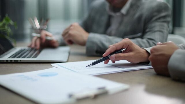 Business professionals collaborate at a modern conference table