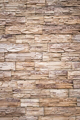 Fototapeta premium Natural stone wall texture with warm tones in rustic style 