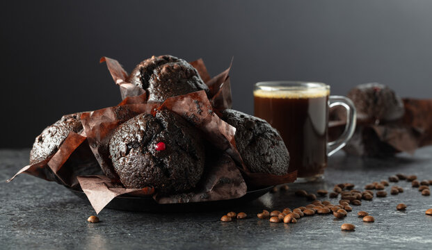 Dark chocolate muffins and cup of black coffee.