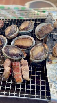 Delicious Korean style grilled pork belly samgyupsal and abalone
