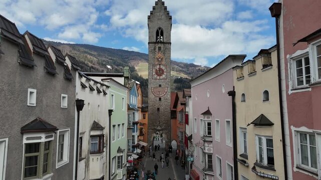 Vipiteno, South Tyrol Town Aerial Drone Ascending Flight Over Main Street and Tower Cinematic