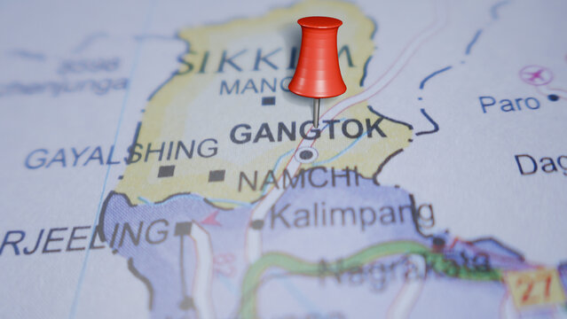 Red pushpin on map marking Gangtok, Sikkim, India, pinpointing a travel destination and geographical location.