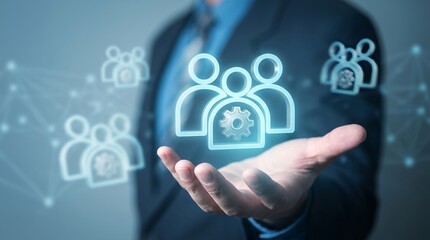 Fototapeta premium Businessman holding a glowing digital human resources icon representing corporate management and effective team building strategy