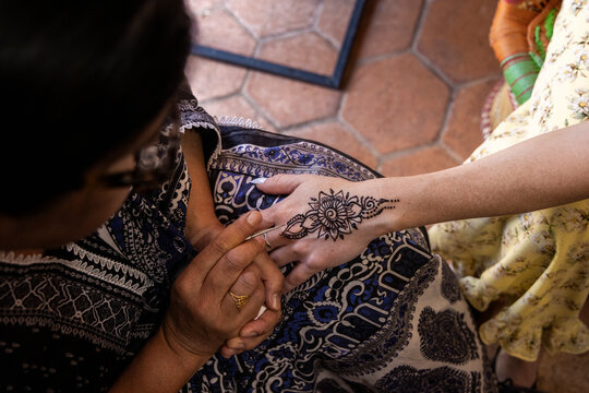 Overhead looking down on henna art on hand