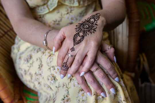Woman's hands with henna body art
