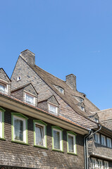 Obraz premium Detail of a house made of natural slate tiles in Goslar in Germany