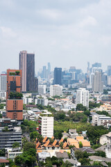 Naklejka premium Dense Bangkok Cityscape With Modern Buildings And Skyline, Vertical Urban View With Copy Space And Metropolitan Development Concept