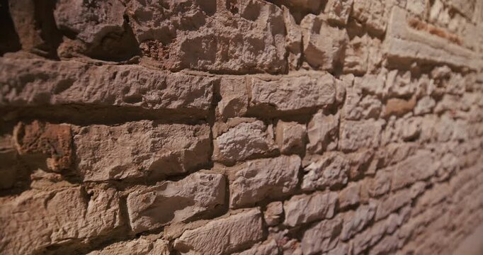 Close-up detail of rough stone blocks on the exterior wall of the Cathedral of the Assumption of the Blessed Virgin Mary.