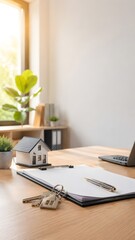 Modern real estate office desk with house model keys clipboard laptop and property contract concept