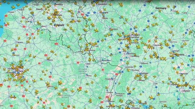 Air traffic monitoring map with aircraft movements across European region, digital aviation interface displaying active commercial routes