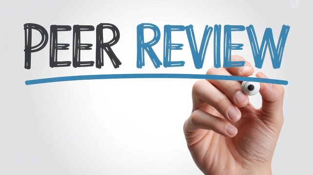 A hand holding a marker writing the word Peer Review isolated on white background