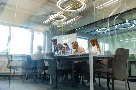 Business office with blurred people casual wear, with blurred bokeh background.